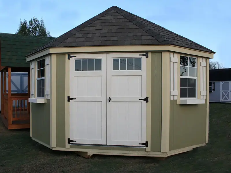 A large shed with two doors and windows.
