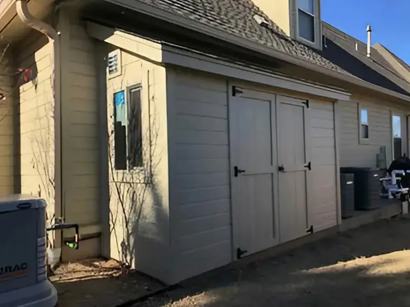 A garage with two doors and a window.