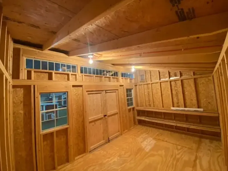 A room with wood paneling and wooden floors.